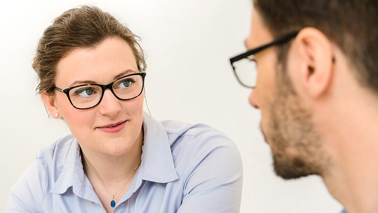 Woman talking to a colleague