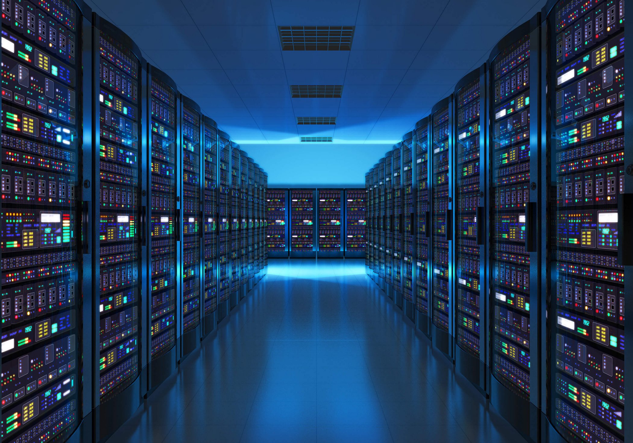 Server rows in blue-lit data centre with reflection on floor