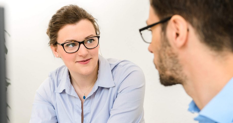 Woman talking with colleague