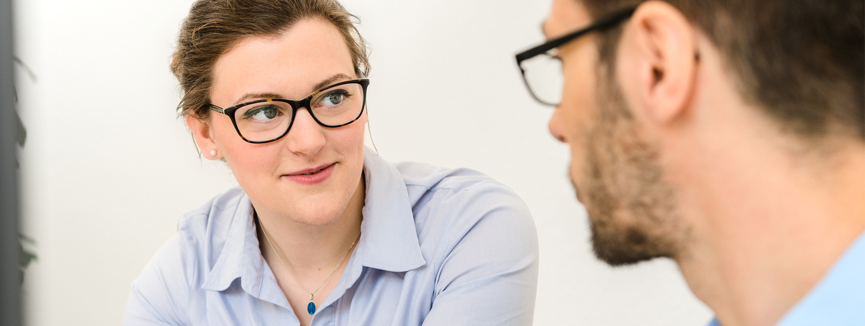 Woman talking to a colleague