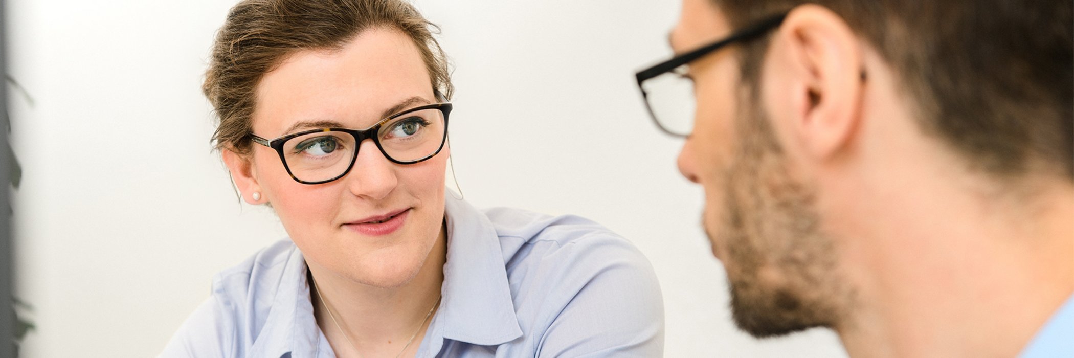 Woman talking to a colleague