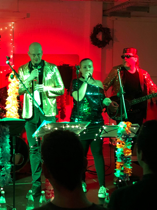 The band IVU.groove on stage performing at a festival