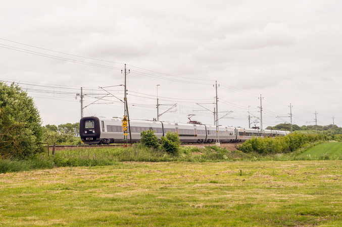 in drives through green fields.