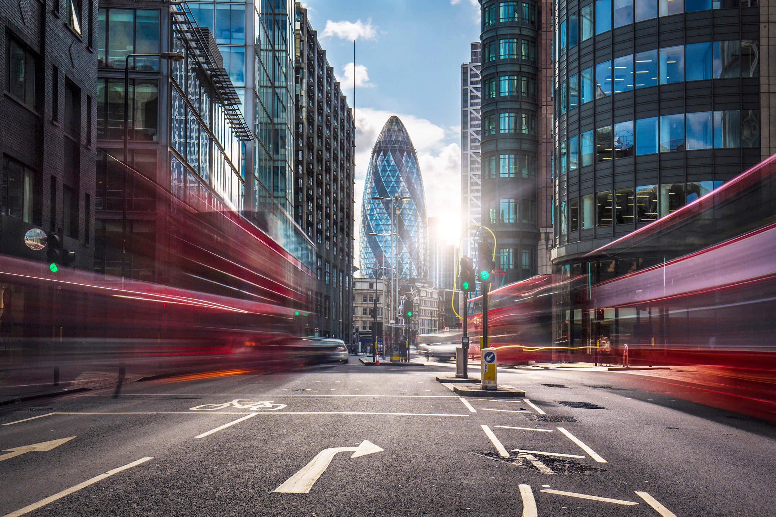 Urban scene with buses in motion blur and digital network lines overlaid