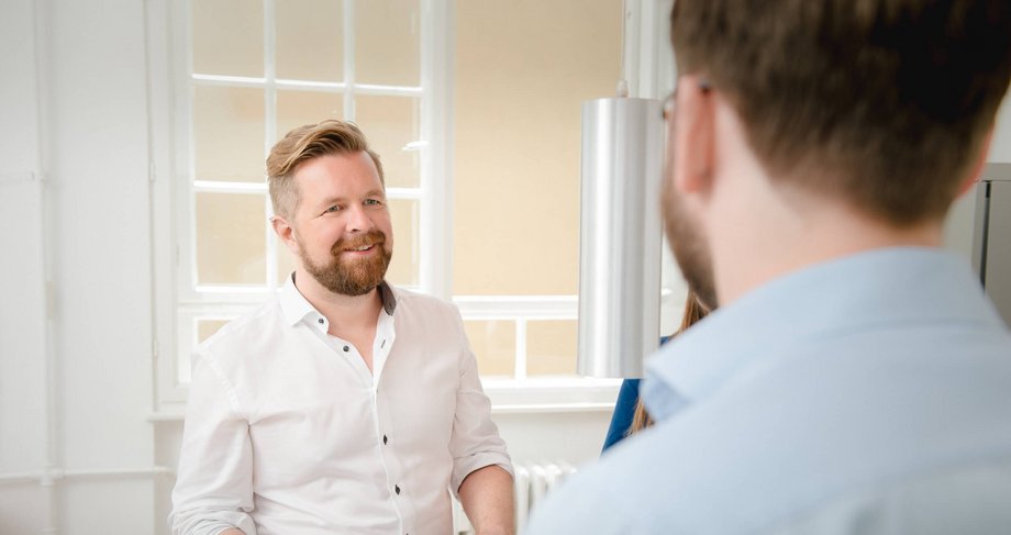 Man talking to a colleague