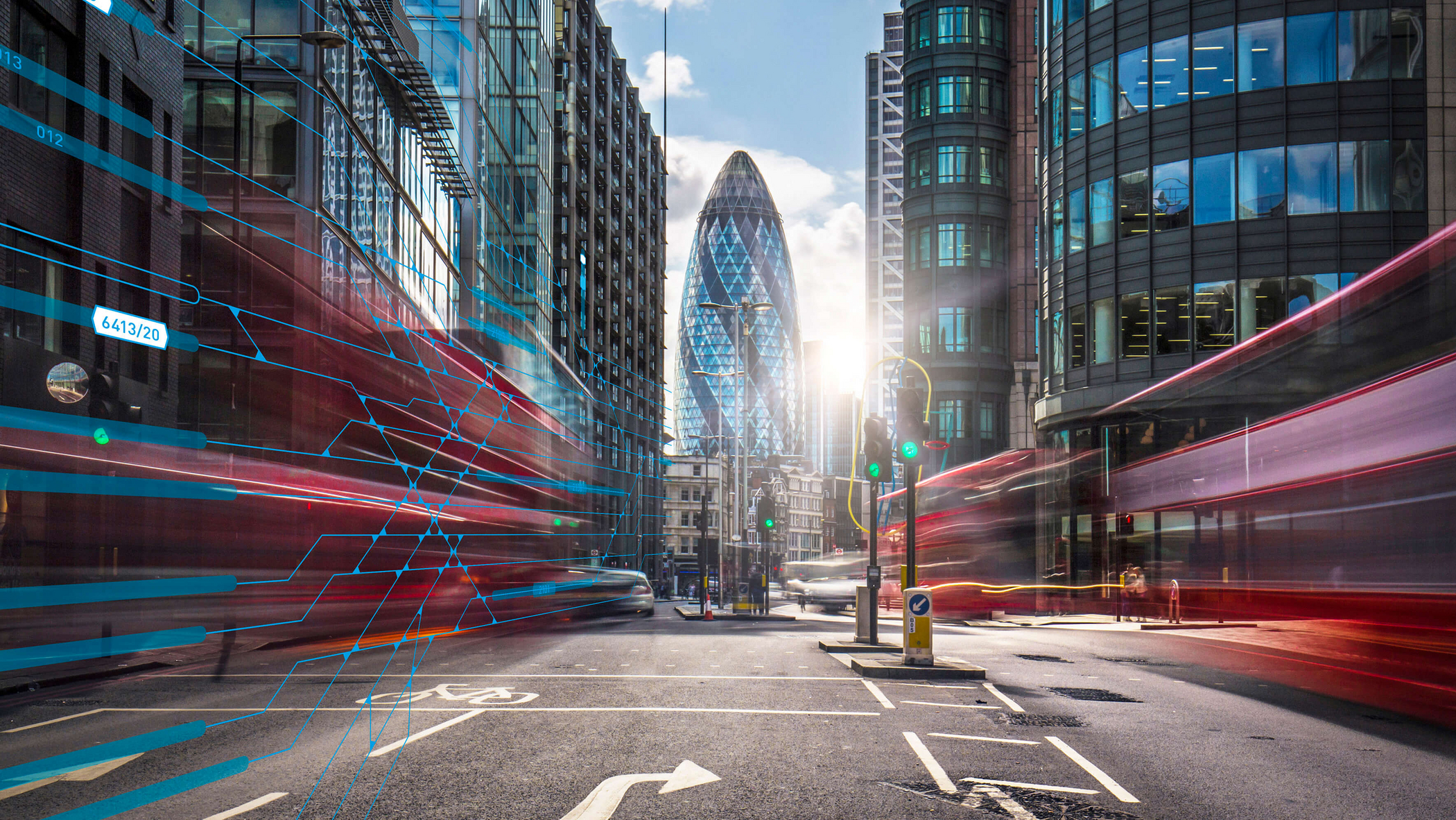 Traffic in London with skyscrapers in the background