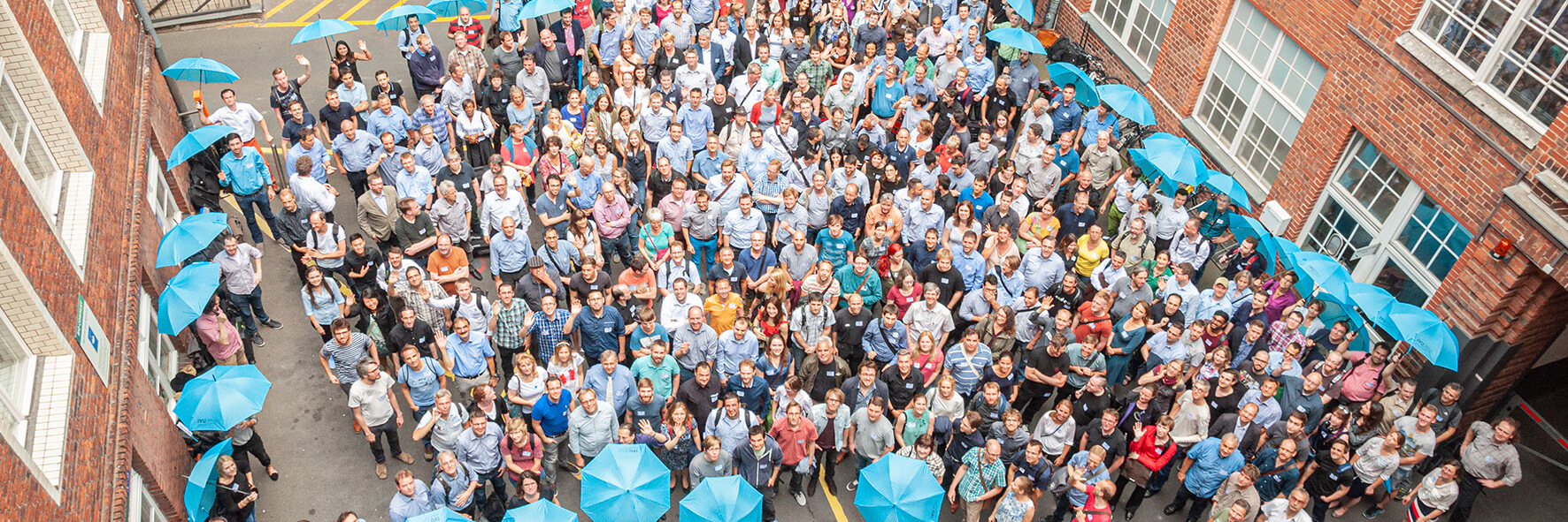 Group photo of IVU employees in the background from a bird's eye view